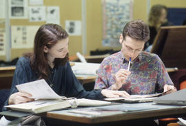 Photograph of Two Students Looking at an Assignment