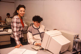 Photograph of two adult learners working together