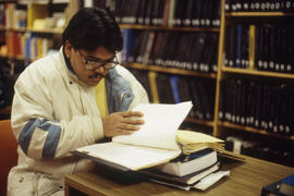 Photograph of a student in the library