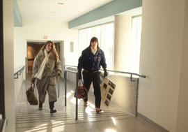 Photograph of two students passing through the ramp walkway