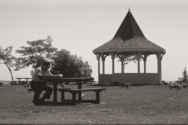 Photograph of a senior sitting at a picnic bench
