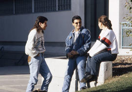 Photograph of students near the main college entrance