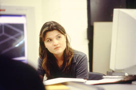 A photograph of a student in a computer lab