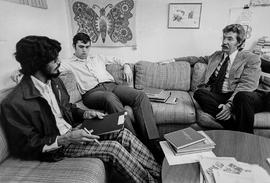 Photograph of Doug Scott Talking to Two Students in His Office