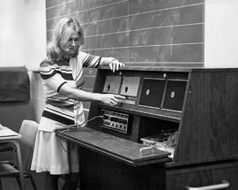 Photograph of Grace Allen Listening to Audio from a Radiogram
