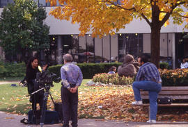 Photograph of a student setting up for a video shoot