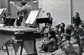 Photograph of Tony Mergel Leading the Humber Band in a Performance