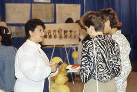 Photograph of persons in conversation