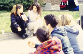 A photograph of students sitting outdoors