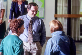 Photograph of Joe Kertes with attendees during the School for Creative Writing summer workshop
