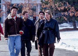 Photograph of People Walking Towards the Main Entrance