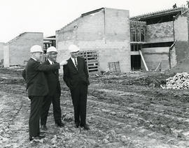 Photograph of Gordon Wragg and others inspecting the North campus construction site
