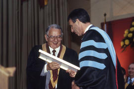 Photograph of President Dr. Robert Gordon making a special presentation