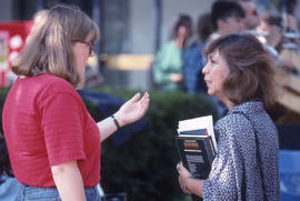 Photograph of People Talking Outside