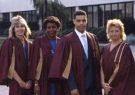 Photograph of graduates posing outside
