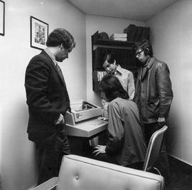 Photograph of Gary Bannister and Students in Paul Petch's Office using a Computer