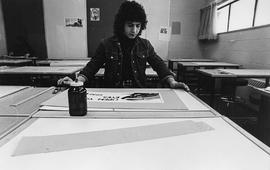 Photograph of a Student Working on a Poster