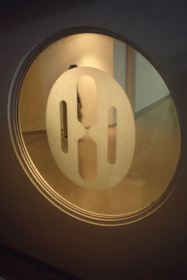 Photograph of the Humber College logo etched into the glass in the library stairwell