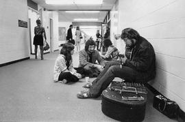 Photograph of Bryan Beatty Sitting on the Floor Speaking to Muisc Students
