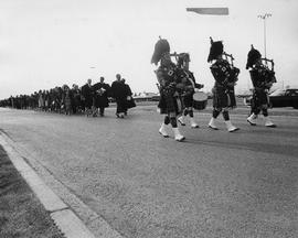 Photograph of A Pipe and Drum Corps Leading the Procession of Graduating Students