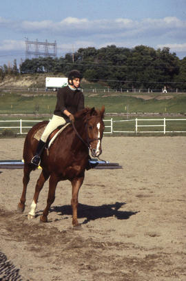 Photograph of an unknown student on a horse