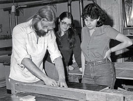 Photograph of Cathy Farah Working with Students in the Workshop Rehabilitation Program