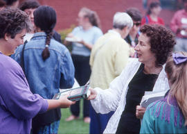 Photograph of Margaret Atwood autographing books