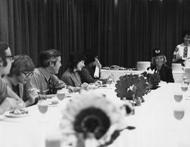 Photograph of Helga Forstreuter Sitting at the Head of the Table at Igor Sukor's Event