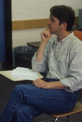 Photograph of a Student Sitting in Class