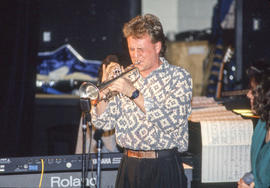 Photograph of a student musician playing a trumpet