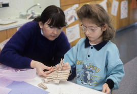 Photograph of an Early Childhood Education student working with a child