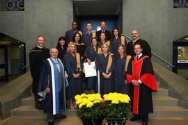 Group graduation photo featuring President John Davies : [photograph]