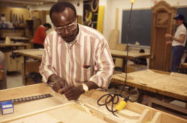 Photograph of a Student Making a Cabinet in Lab