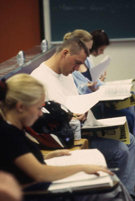 Photograph of Hospitality students reviewing their notes in the Bartending classroom