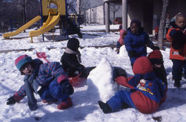 Photograph of children from the daycare centre playing outdoor in the snow
