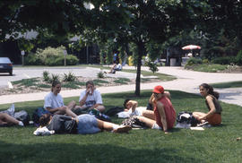 Photograph of Students Sitting on the Lawn