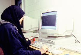 A photograph of a student at work on the computer