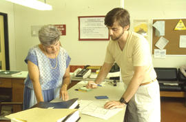 Photograph of two persons in the Financial Aid Office