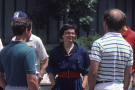 Photograph of staff and visitors conversing outside