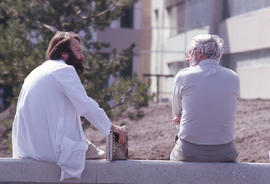 Photograph of two instructors in conversation
