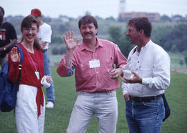 Photograph of three students at a Creative Writing School event outside