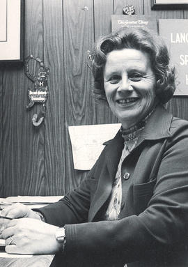 Photograph of Doris Tallon Sitting at her Desk