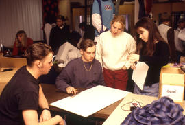 Photograph of students working on a display project