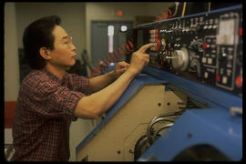 Photograph of a Student Working on a Control Console