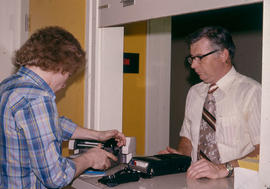 Photograph of a Student at the LRC Equipment Distribution Service Counter