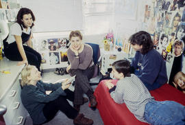 Photograph of students gathered together and chatting in a residence dorm
