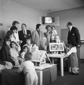Photograph of Gordon Wragg and Igor Sukor Admiring the Gingerbread House at Etboicoke General Hos...