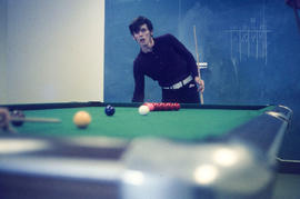 Photograph of a student playing Snooker