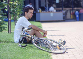 Photograph of a student enjoying the sunny outdoors