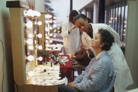 Photograph of a student applying makeup